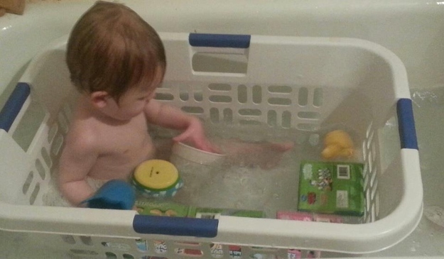 Using a laundry basket in the tub can be a great way to keep a young toddle